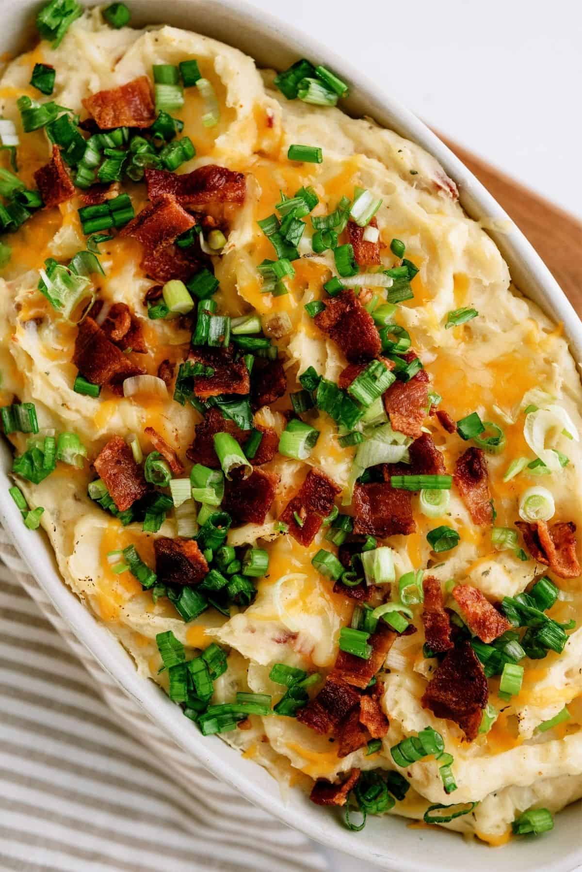 close up of Cheesy Ranch Potatoes in a baking dish