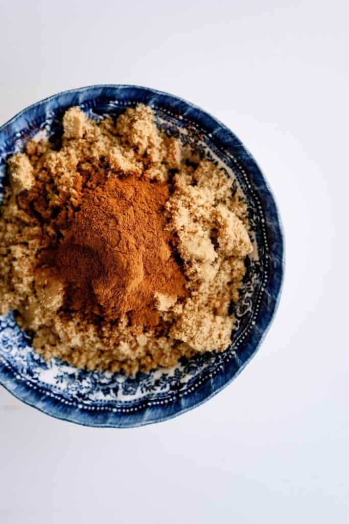 Brown sugar and cinnamon in a blue bowl.