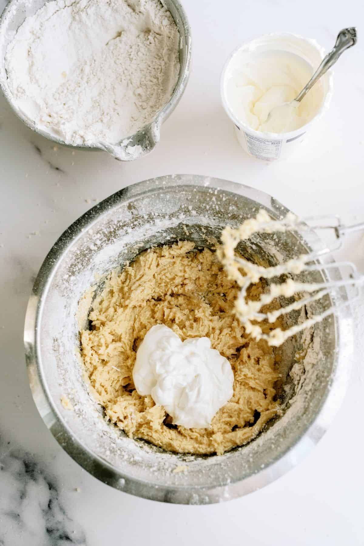 Wet ingredients mixed together in a bowl with a hand mixer