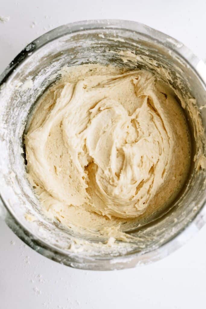 Bread dough in a mixing bowl.