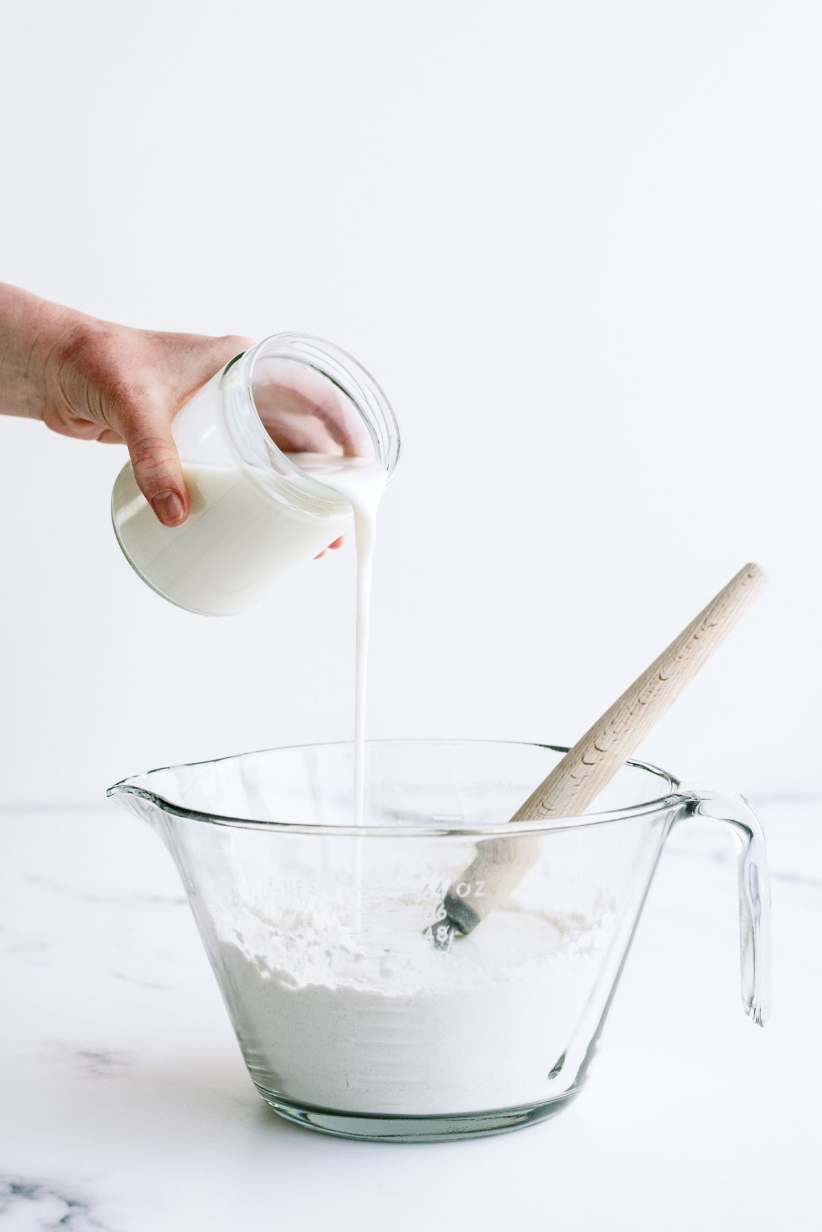 Pouring buttermilk into the dry ingredients
