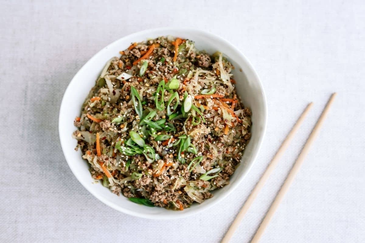 Instant Pot Egg Roll Bowls in a bowl with chopsticks on the side