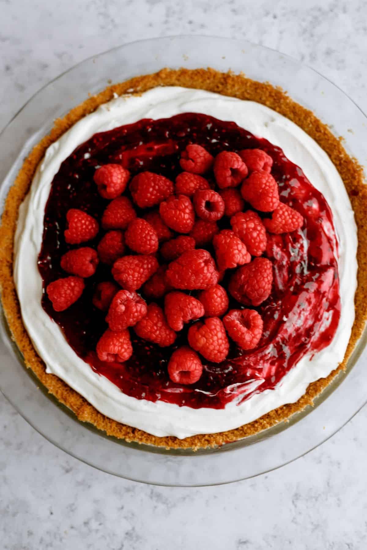 Raspberry Cream Cheese Pie garnished with fresh raspberries