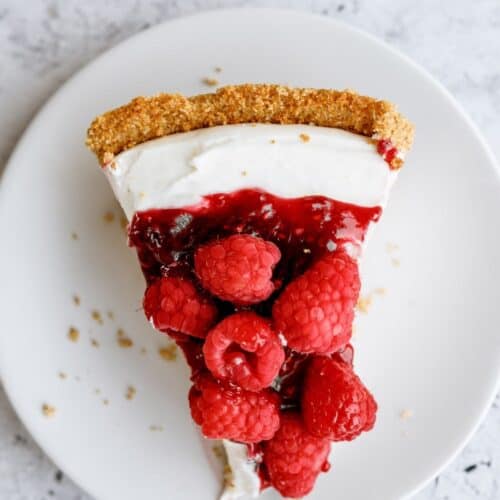 Top view of a slice of Raspberry Cream Cheese Pie on a plate.