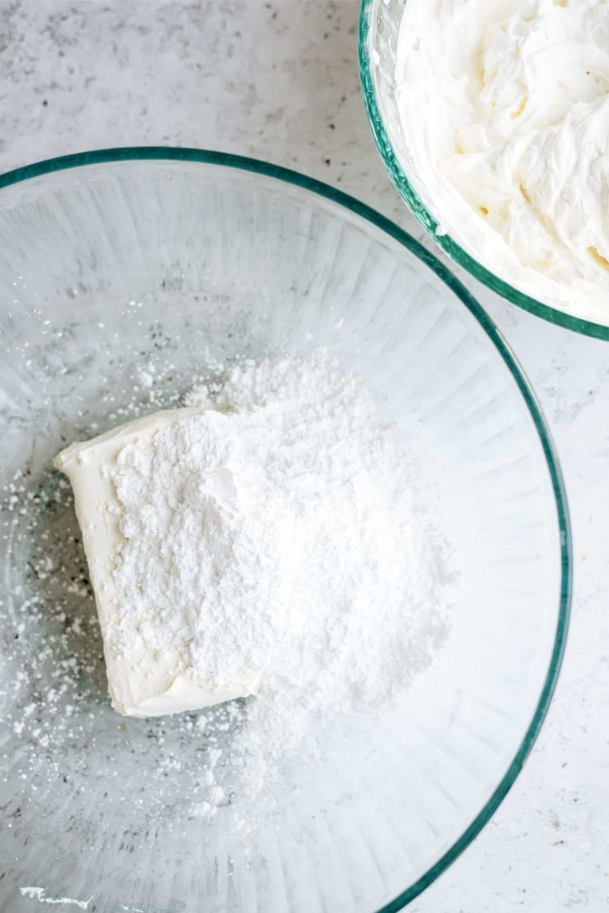 Cream cheese and powdered sugar in a bowl