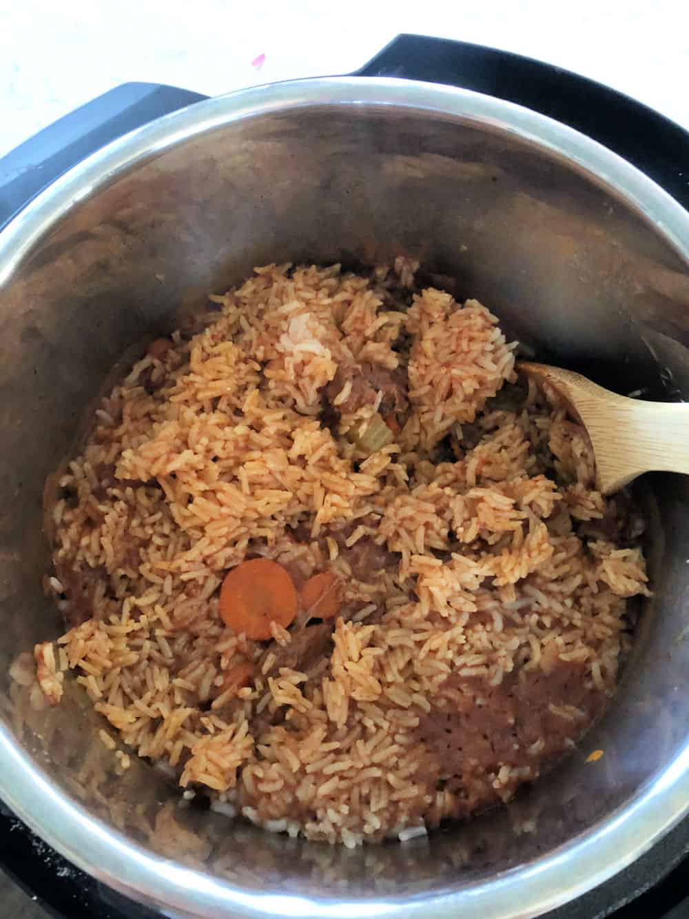 Add rice to the instant pot for Instant Pot Beef and Rice Pilaf with Vegetables