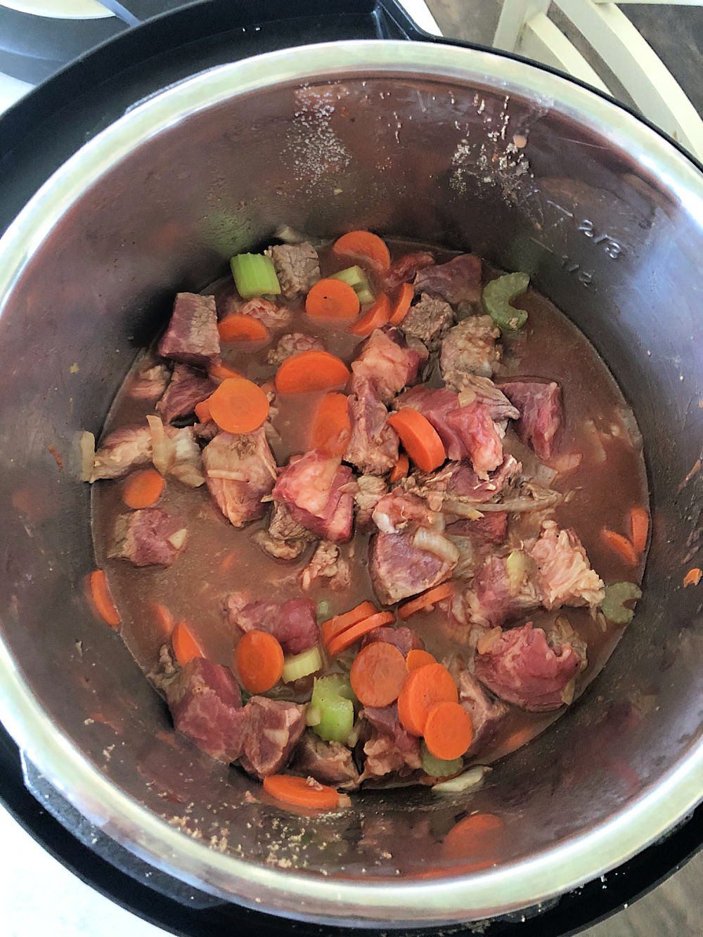 Beef added to the vegetables in Instant Pot