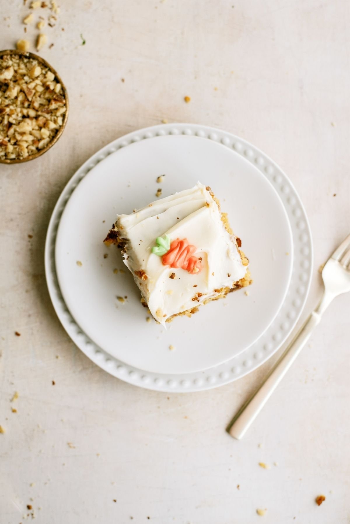 Slice of Best Carrot Cake on a plate with a fork