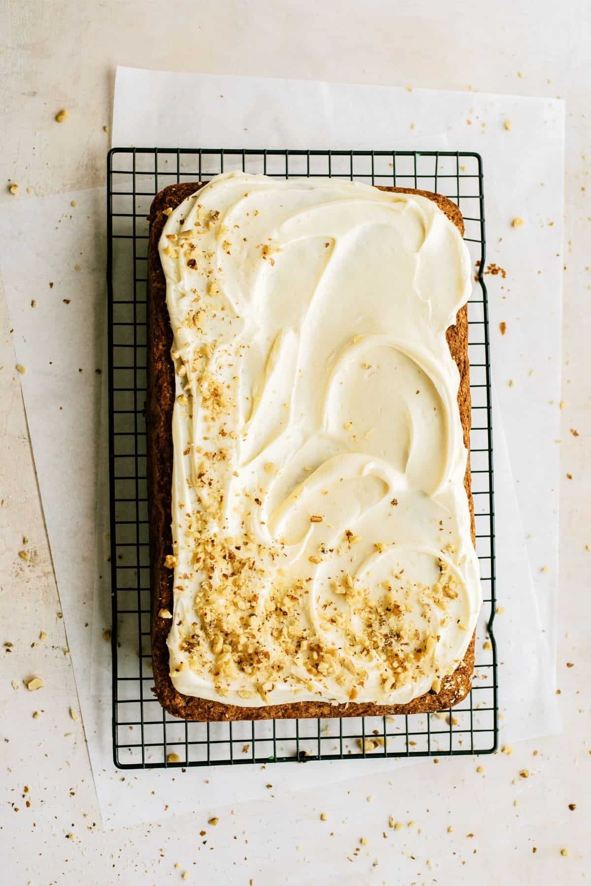 Best Carrot Cake frosted on a cooling rack