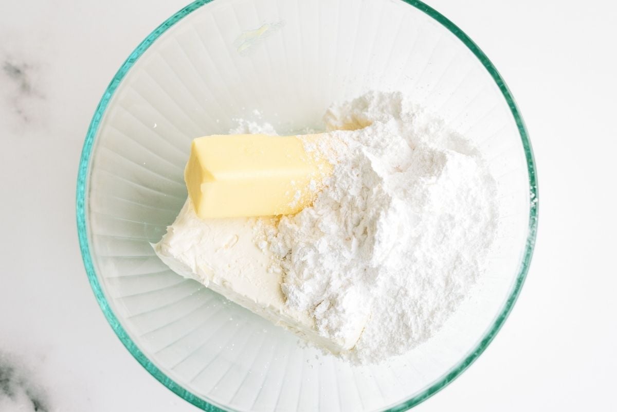 Butter, cream cheese and powder sugar in mixing bowl