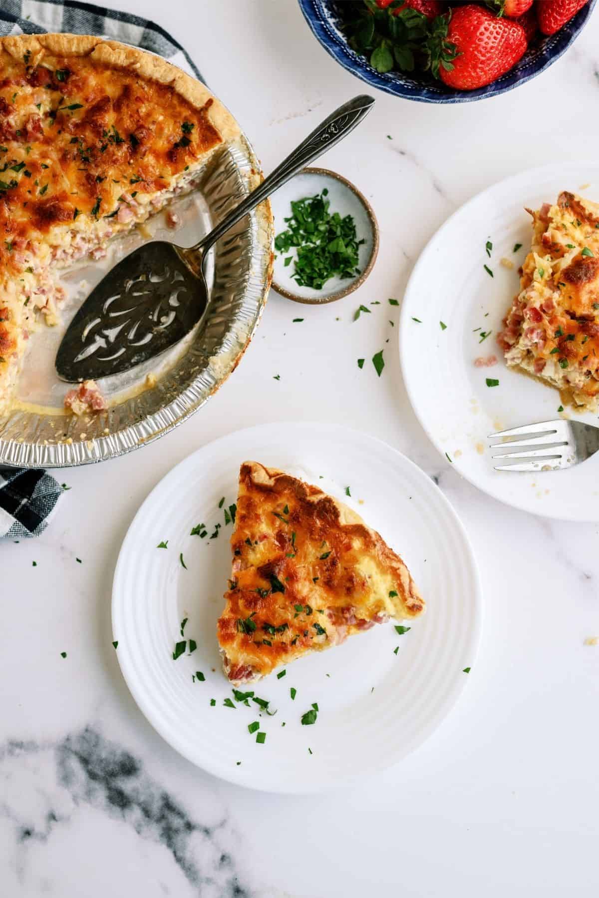 Top view of Easy Ham and Cheese Quiche slice on a plate