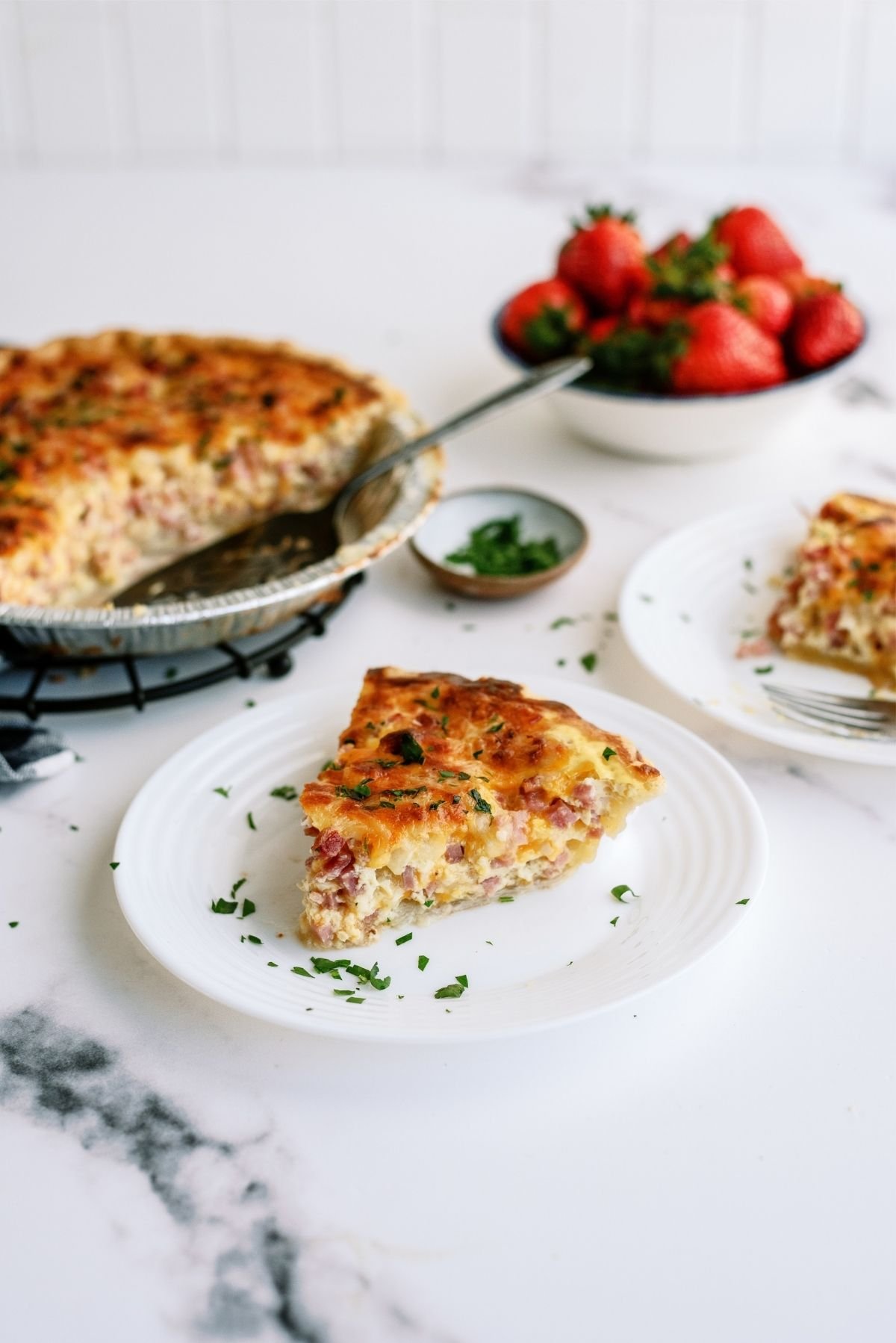 Easy Ham and Cheese Quiche slice on a plate