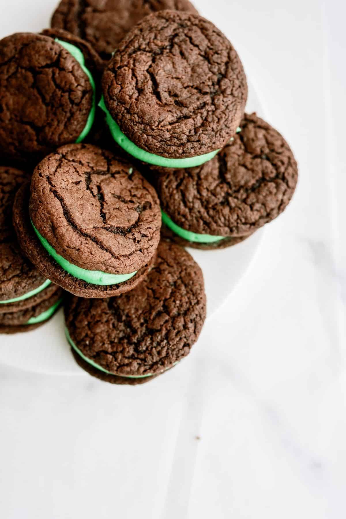 Top view of Grasshopper Sandwich Cookies stacked on a plate