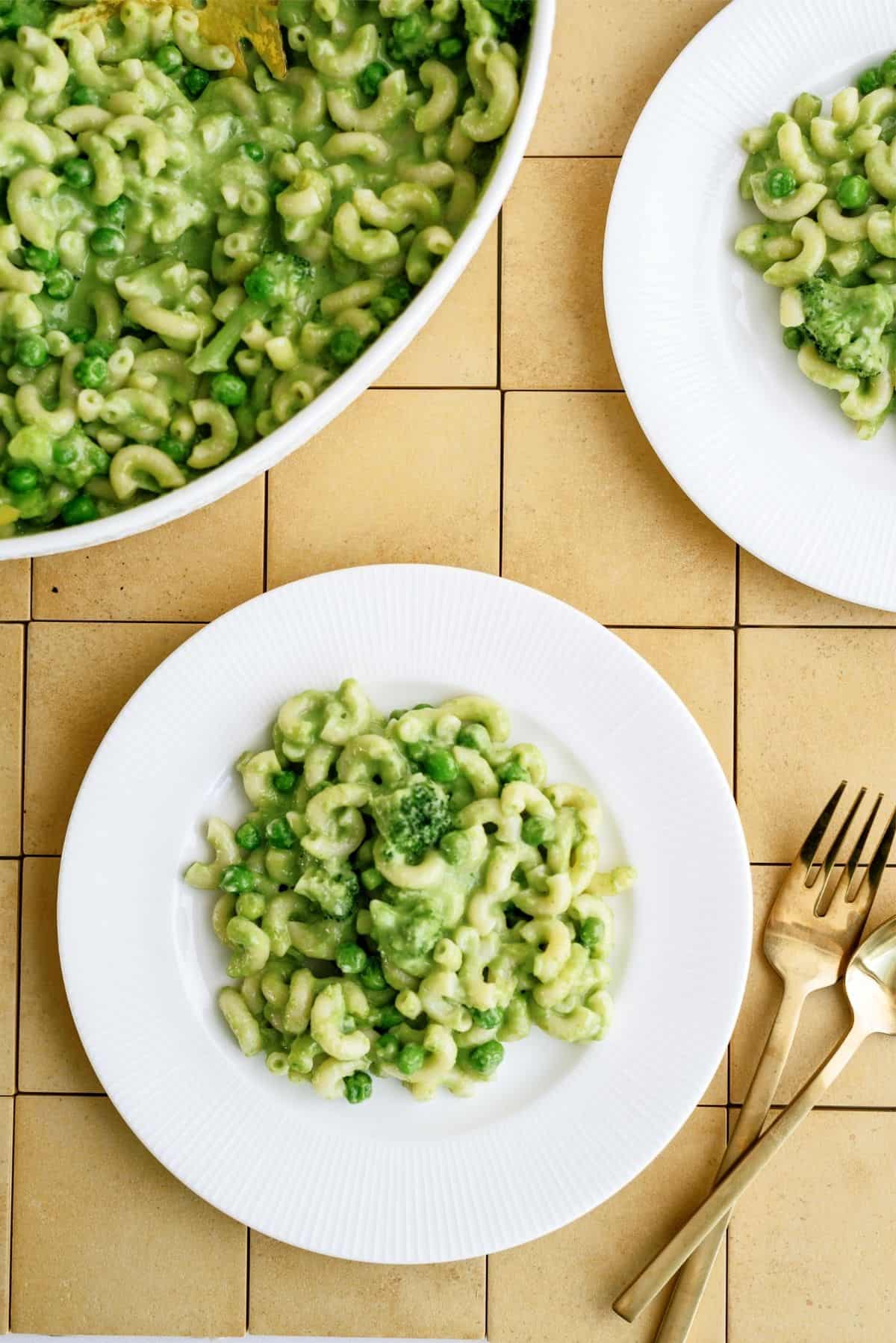 Green Mac and Cheese without Food Coloring on 2 plates and in a casserole dish