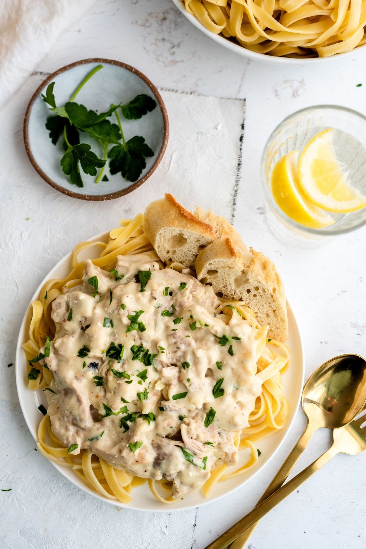 Slow Cooker Creamy Chicken Tetrazzini on a plate topped with parsley