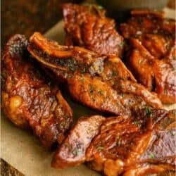 BBQ Slow Cooker Country Style Ribs on a parchment lined dish.