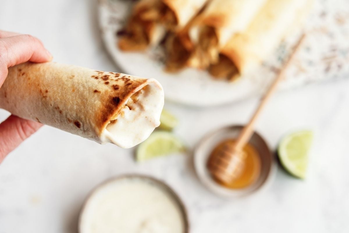Baked Honey Lime Chicken Taquito dipped in ranch