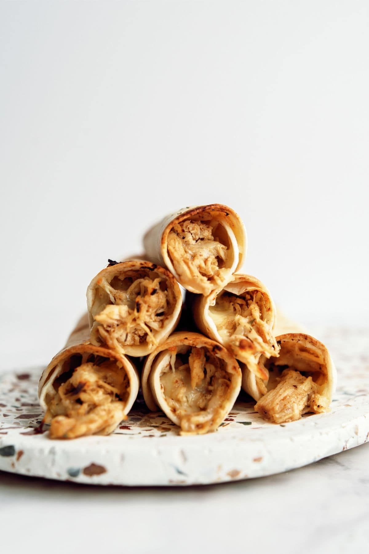 Baked Honey Lime Chicken Taquitos on a serving plate