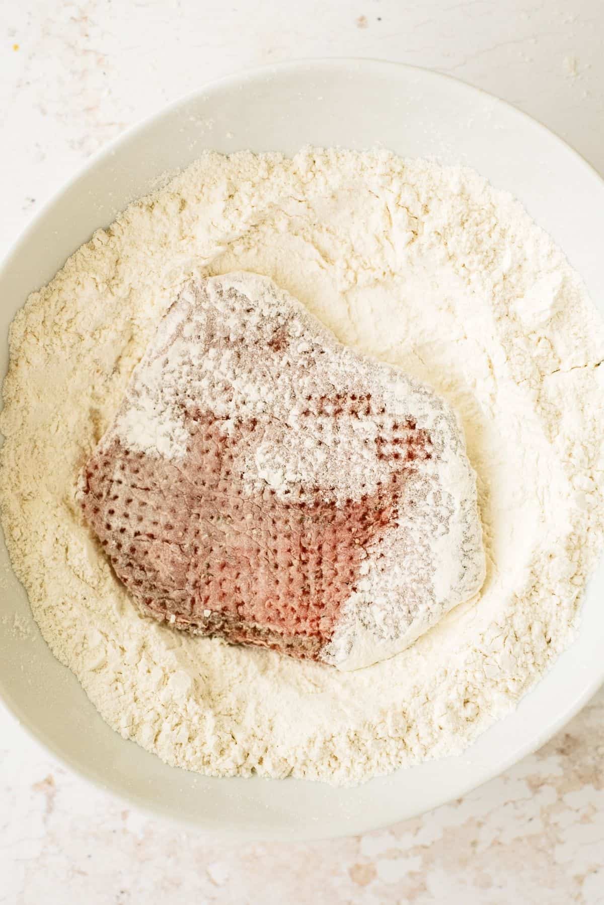 Tenderized meat dredged in flour