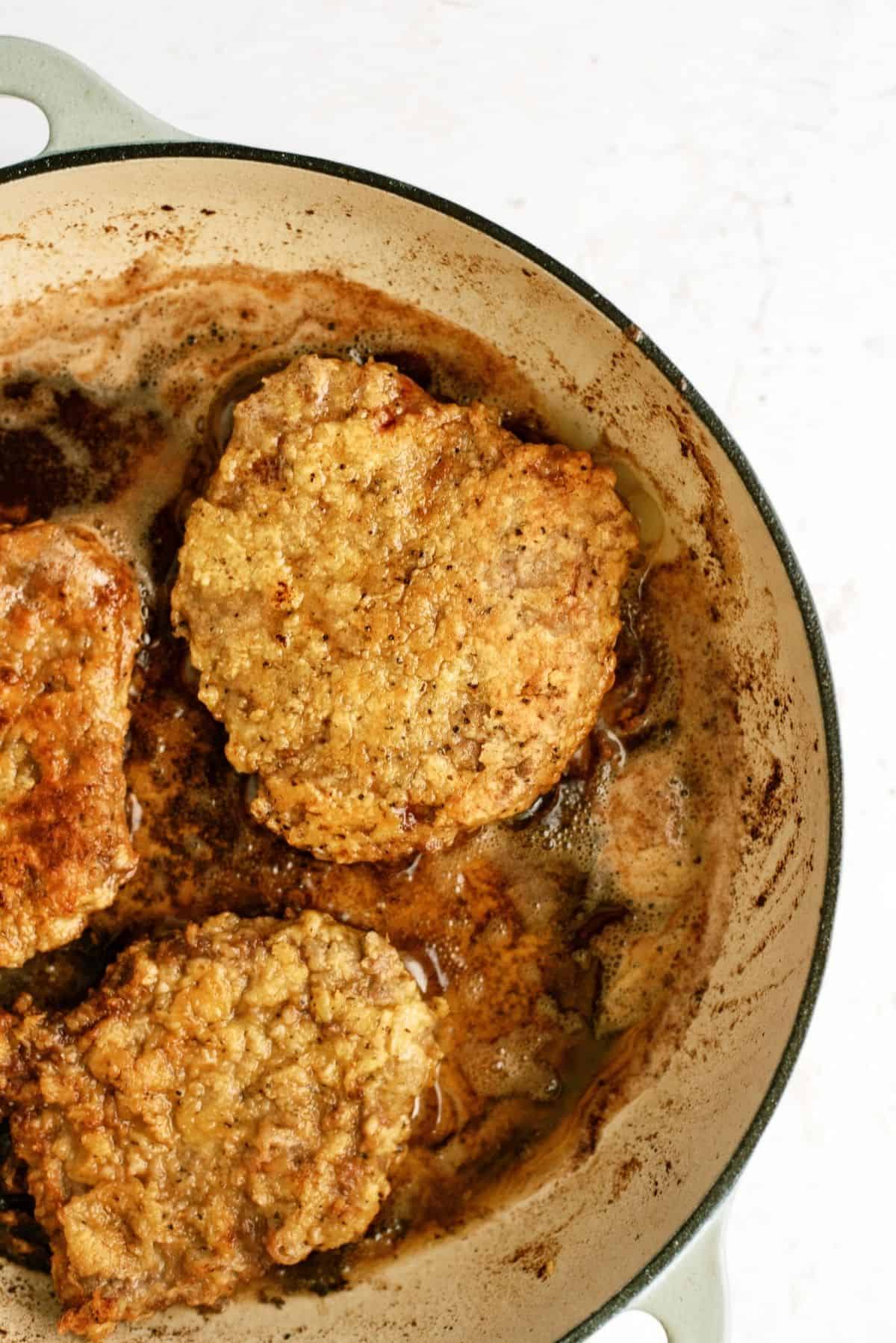 Chicken Fried Steak in a pan being fried