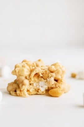 Fluffernutter Cookie (Avalanche Cookie) on a counter with marshmallows and peanuts.