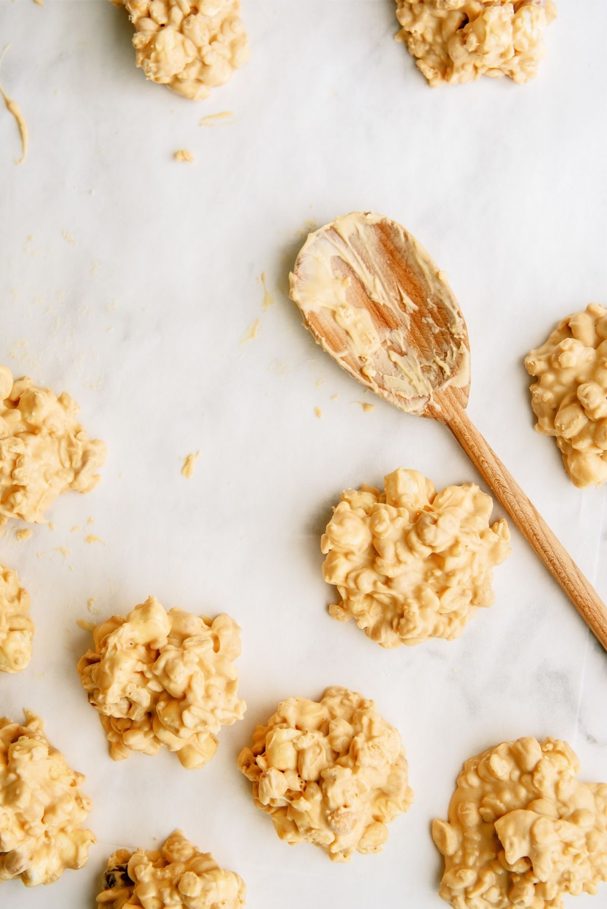Easy No Bake Fluffernutter Cookies on a counter with a wooden spoon