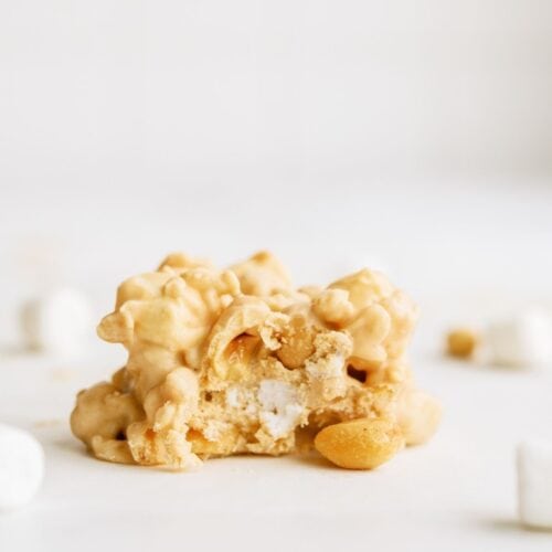 Fluffernutter Cookie (Avalanche Cookie) on a counter with marshmallows and peanuts.