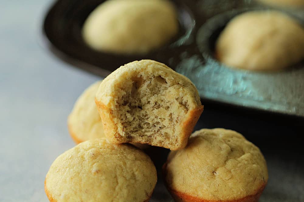 Lion House Banana Muffins stacked with one cut in half