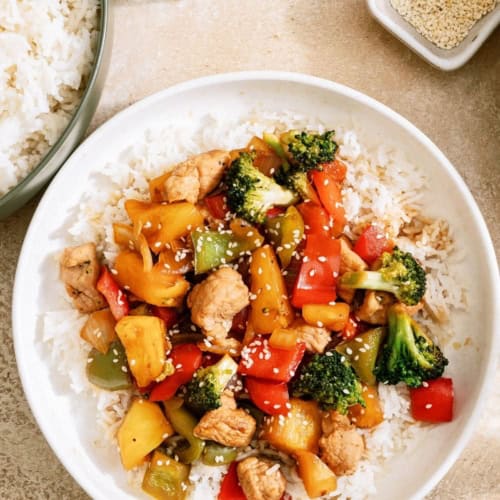 A bowl of Teriyaki Pork Stir Fry served over rice.