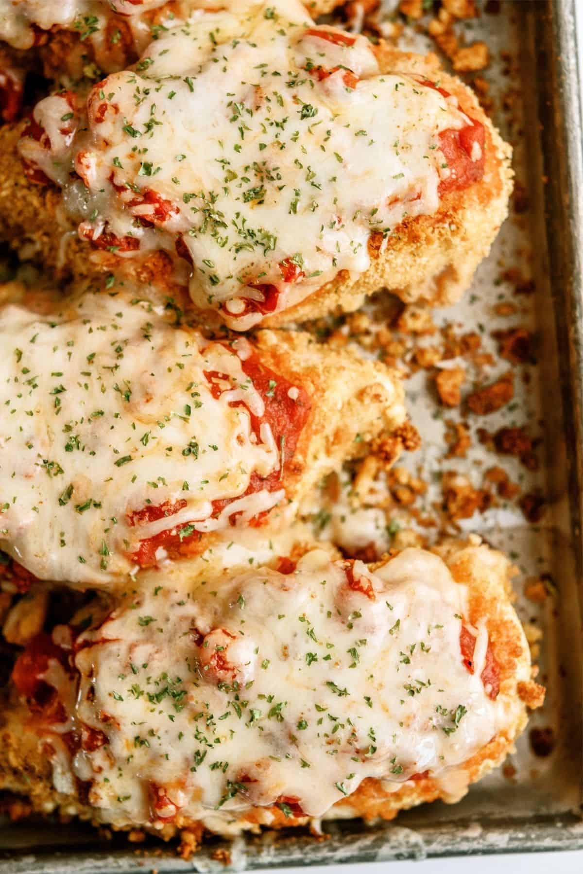 Baked Crispy Chicken Parmesan on a sheet pan