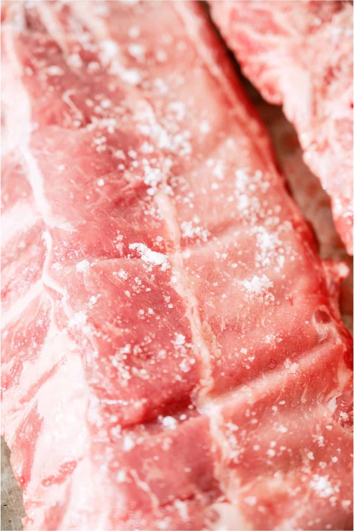 Raw ribs salted.