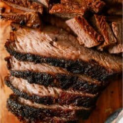 Sliced Easy Smoked Brisket on a cutting board.