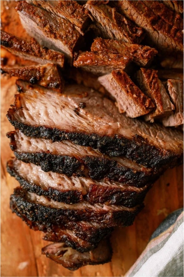 Sliced Easy Smoked Brisket on a cutting board.
