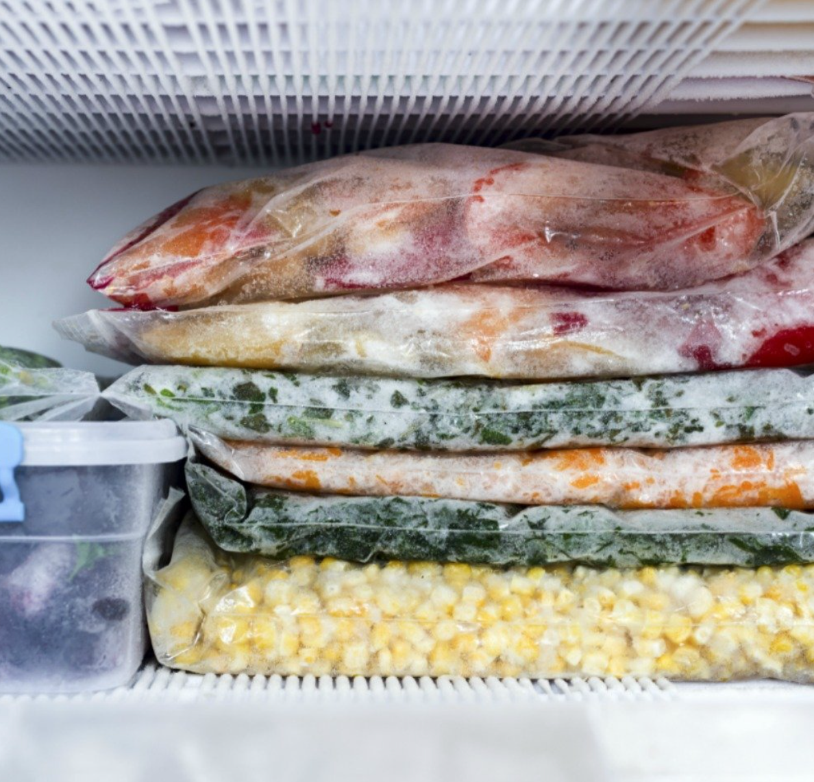 freezer meals stacked in the freezer