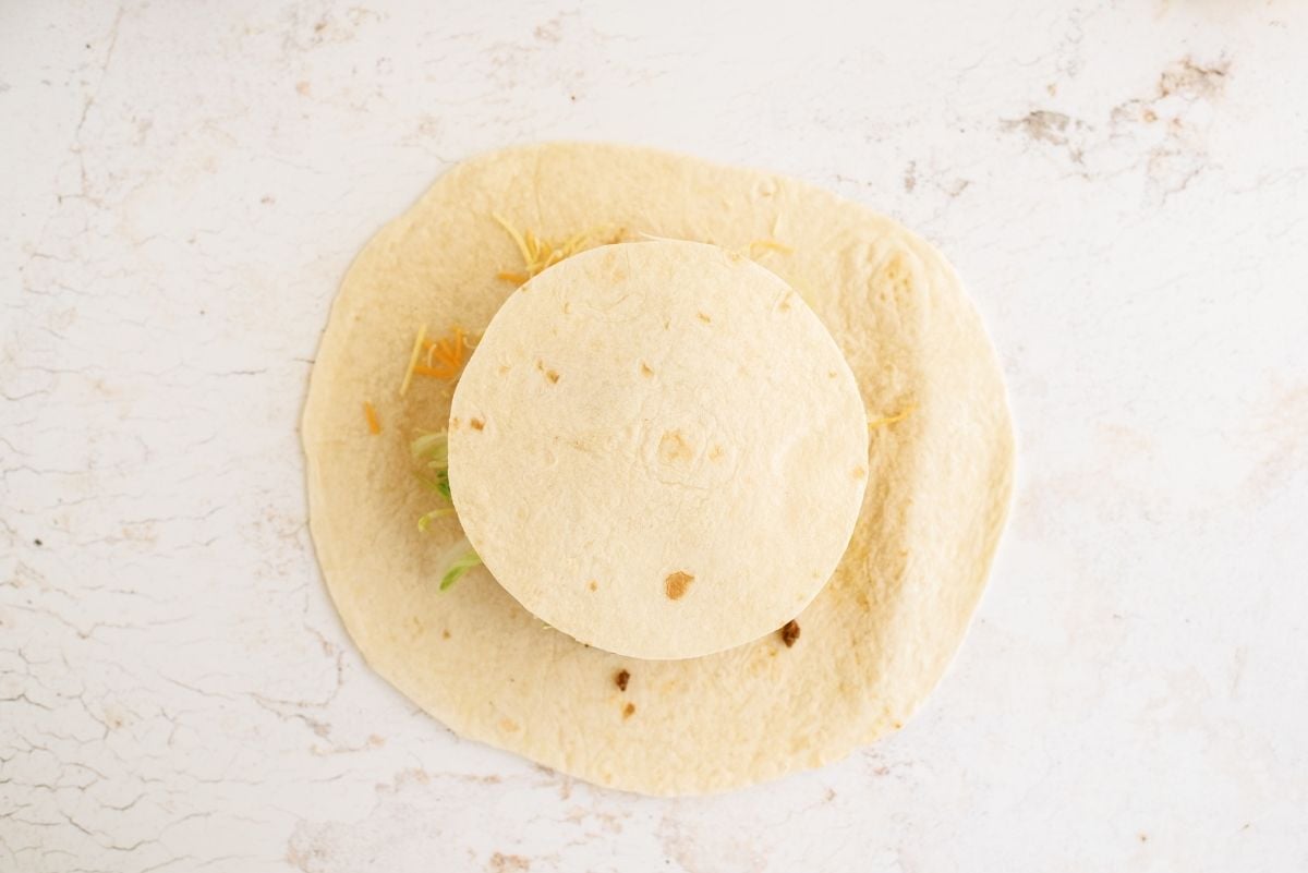 Small tortilla on top of all the other layers