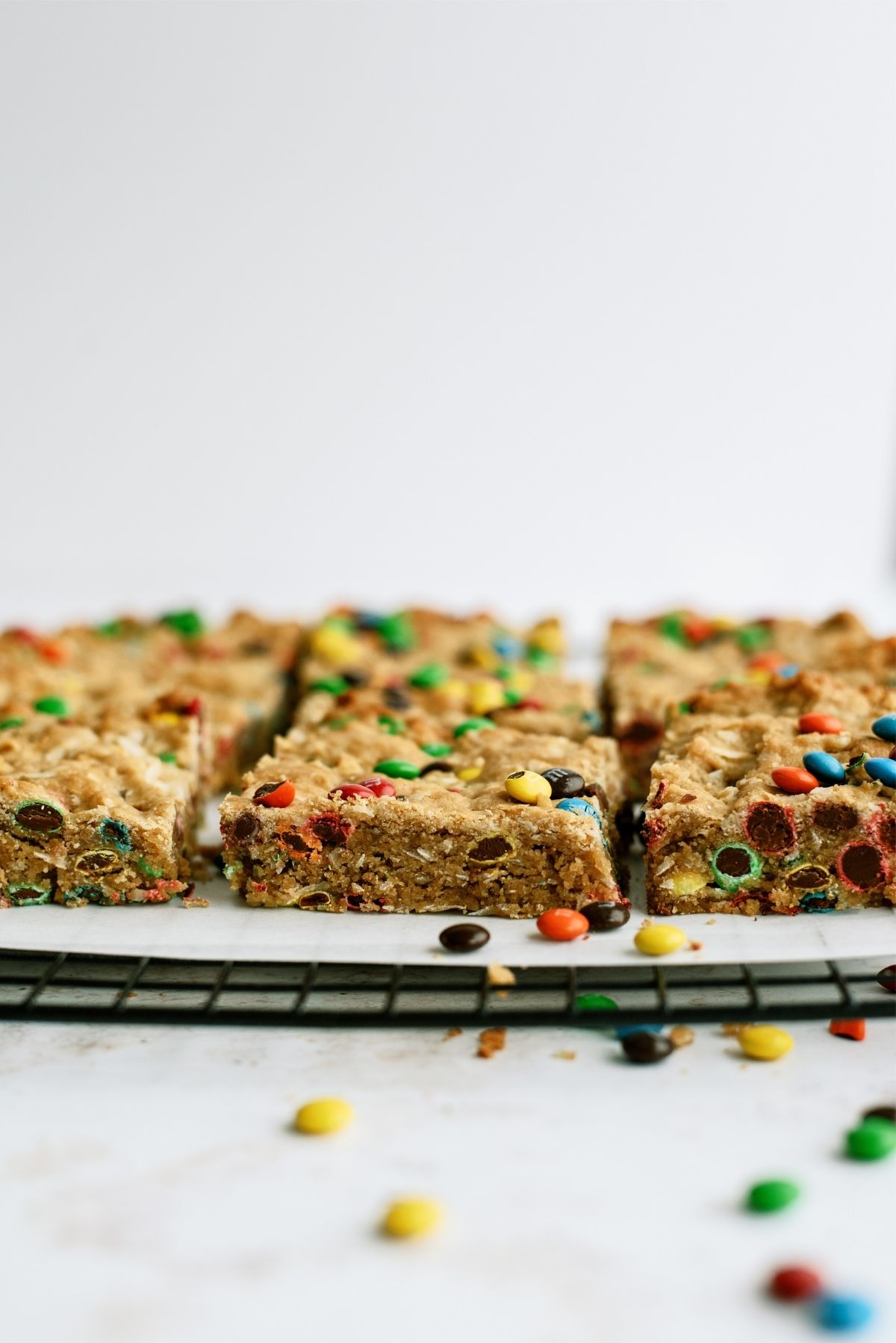 M & M Samoa Blondies cut into squares on a cooling rack