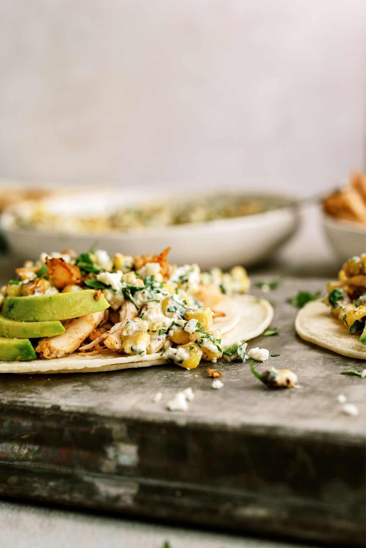 Side view of Mexican Street Corn Chicken Taco with toppings