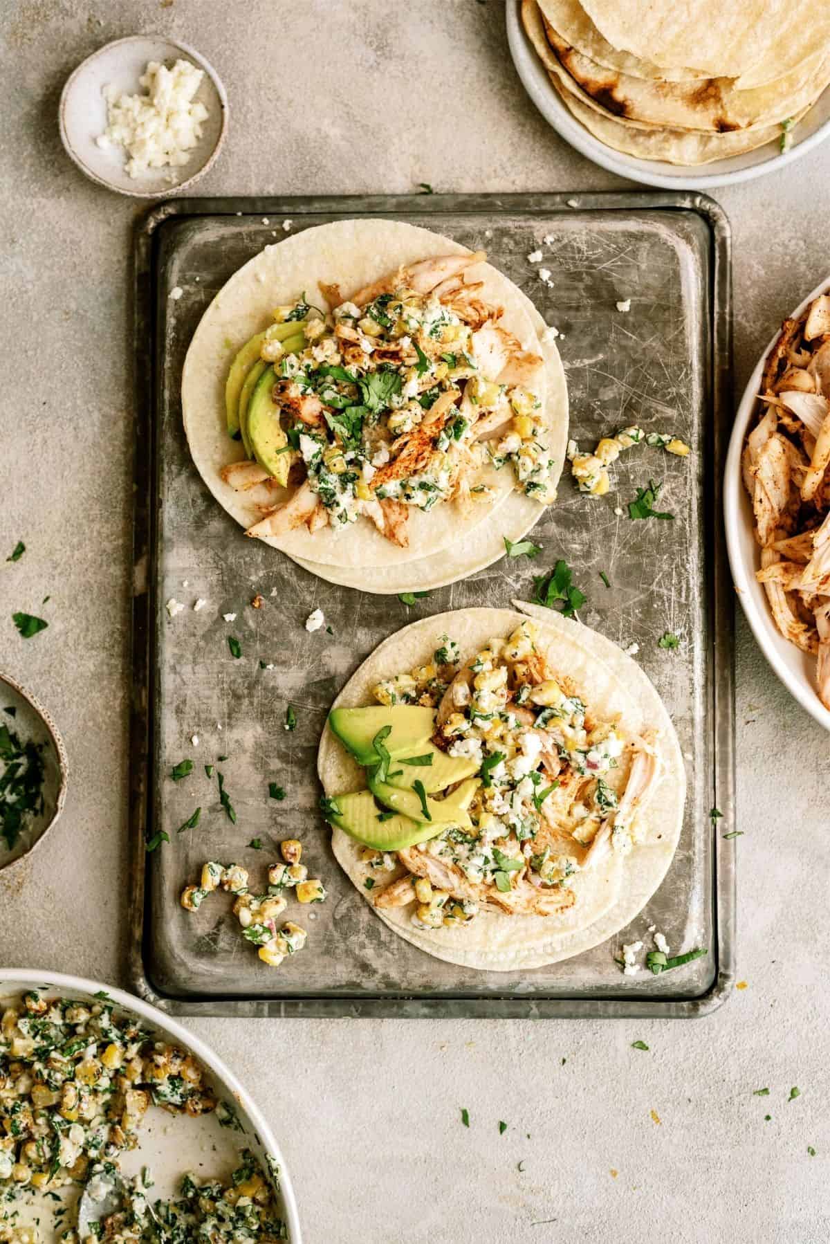 2 Mexican Street Corn Chicken Tacos on a sheet pan 