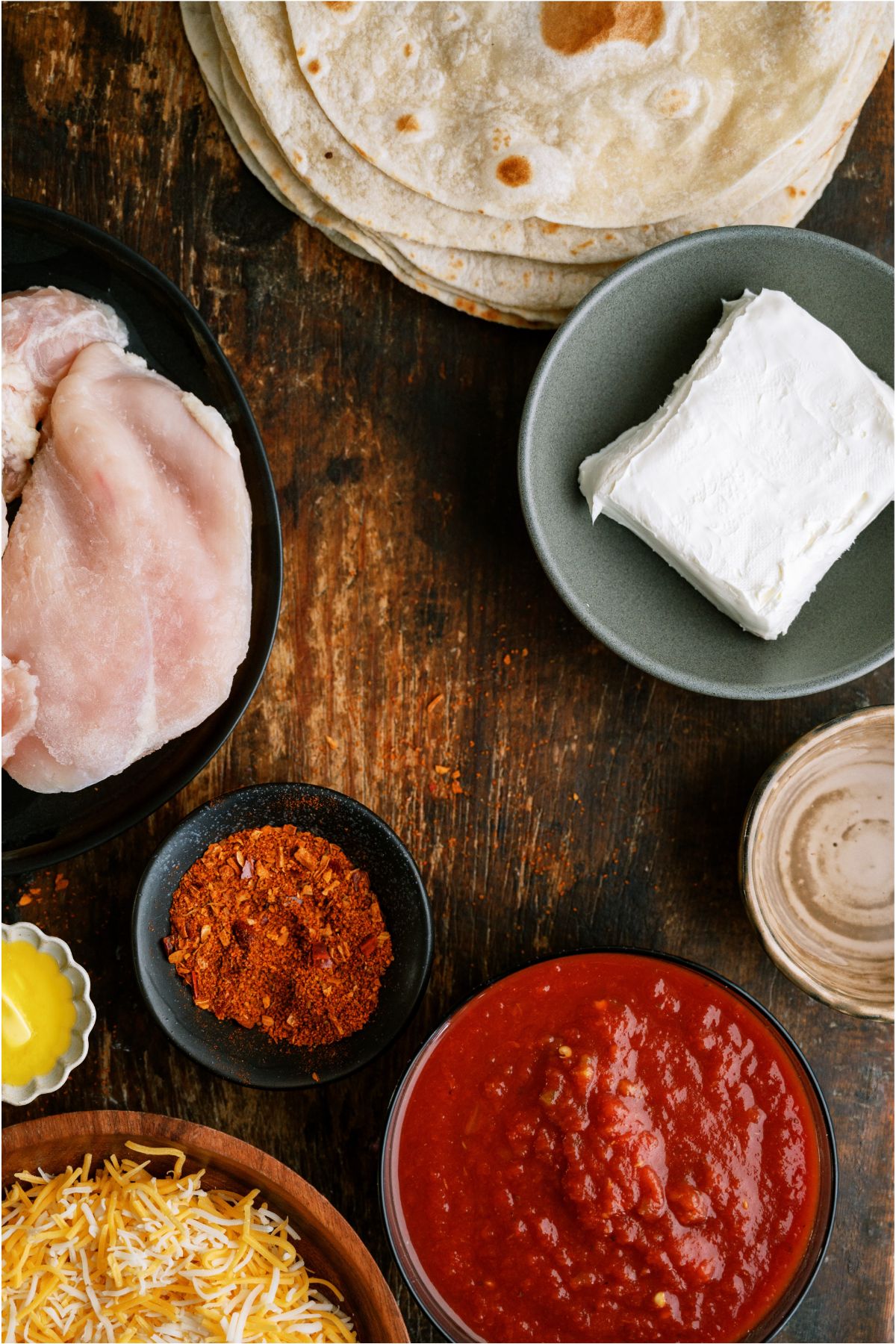 Ingredients needed to make Slow Cooker Cheesy Chicken Taquitos.
