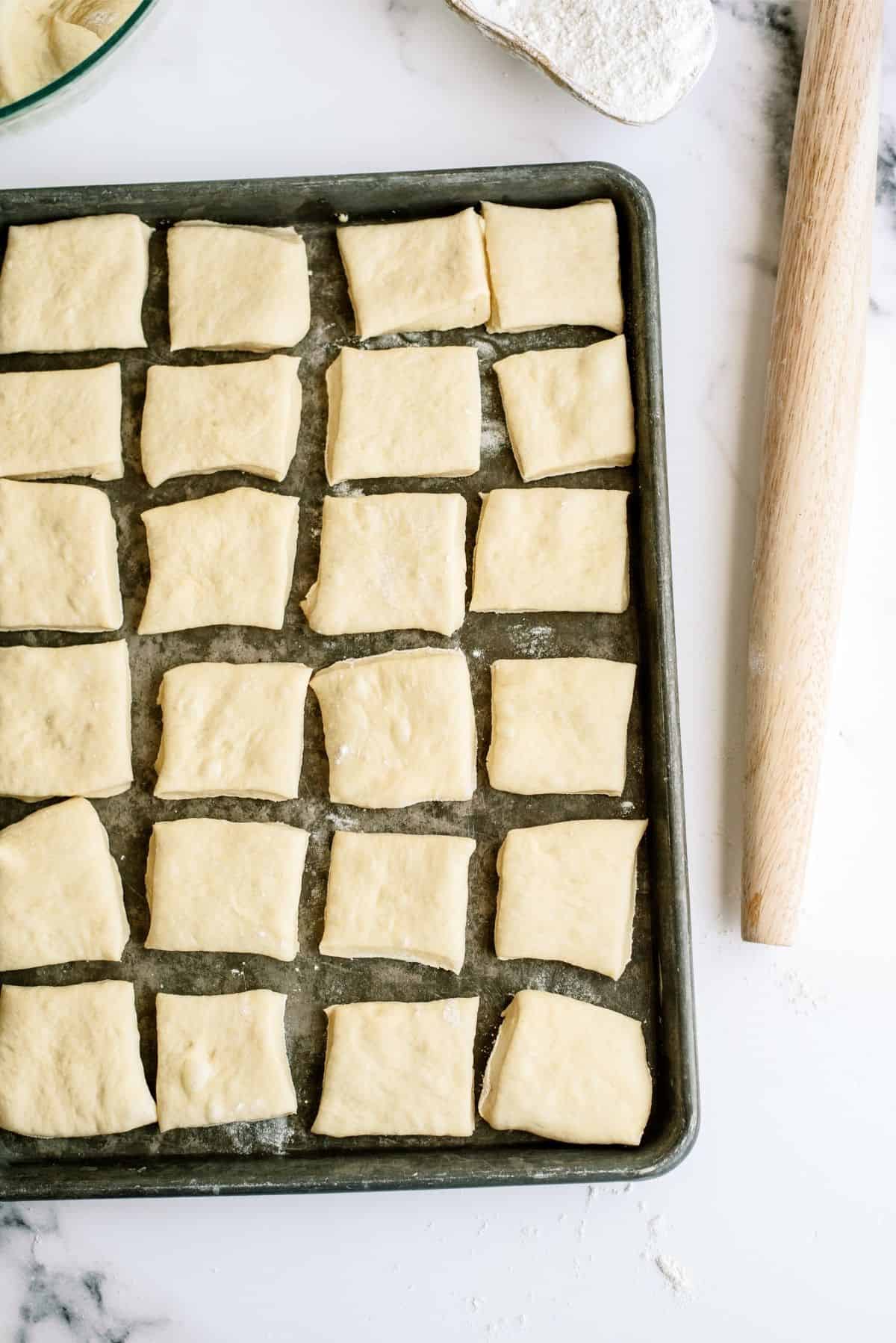 Rolls on baking sheet rising