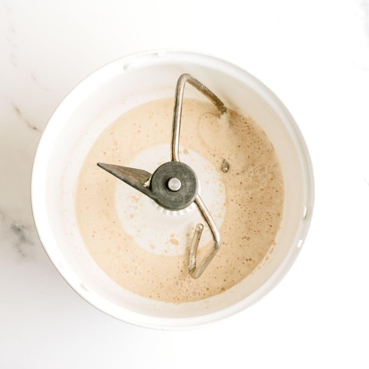 Yeast and warm water mixed together in mixer bowl