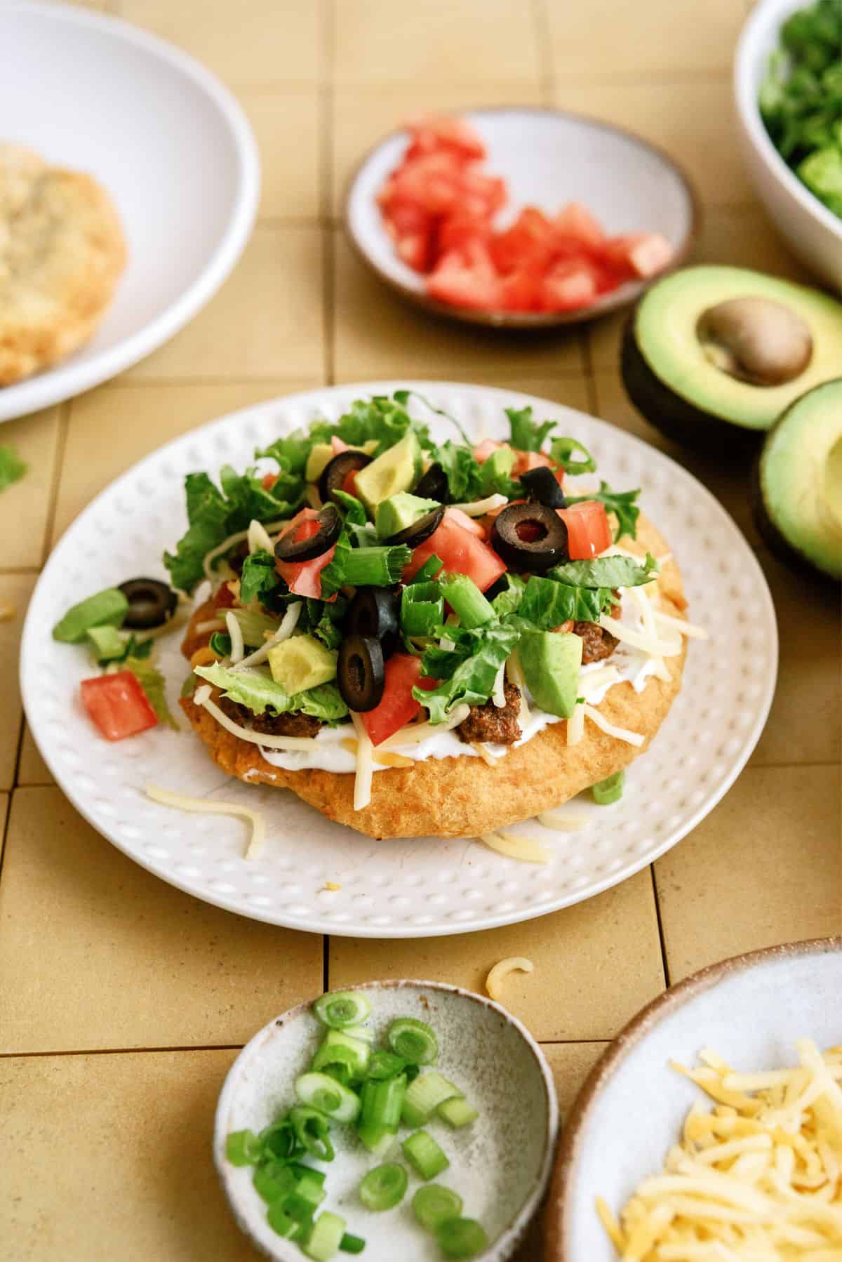 Air Fryer Indian Fry Bread Recipe (Navajo Tacos) with toppings on a plate