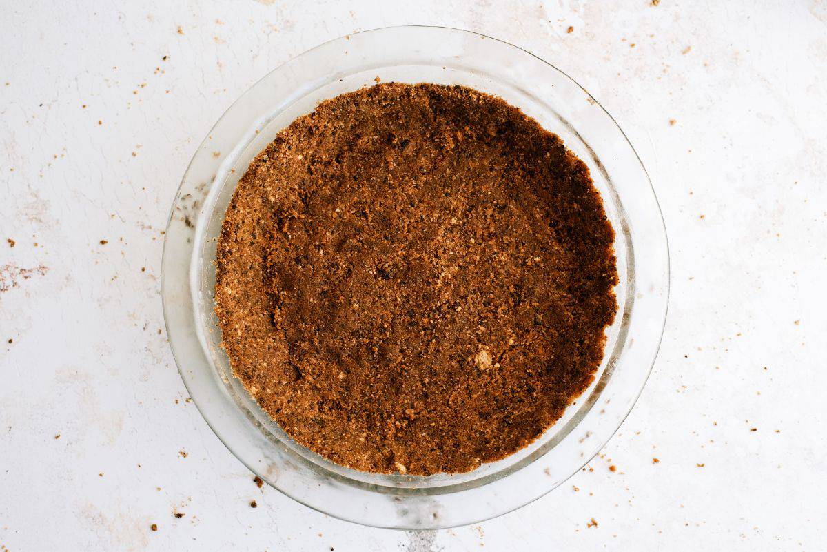 Cookie crumb mixture pressed into pie plate