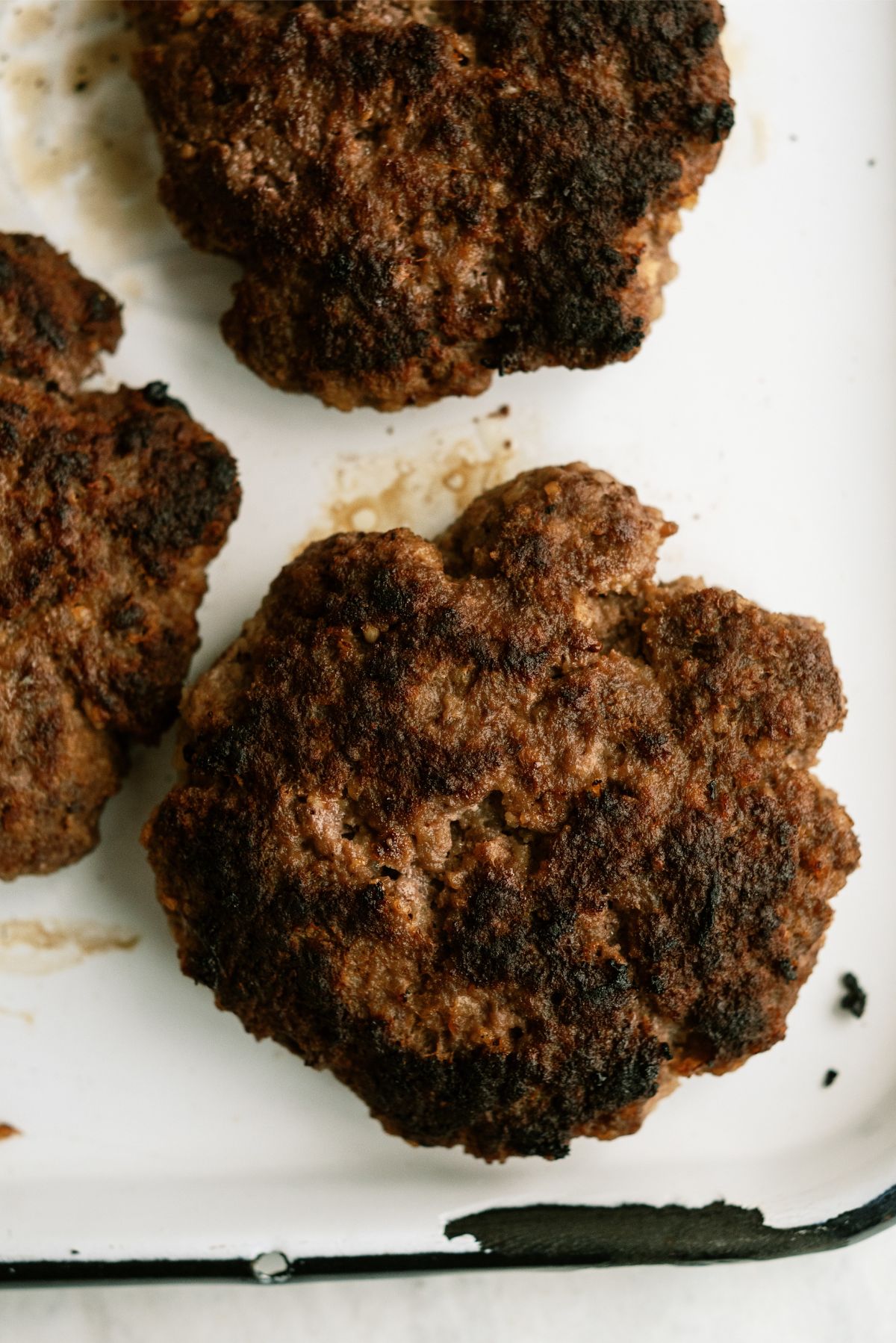 Classic Burger patties on a cooked pan