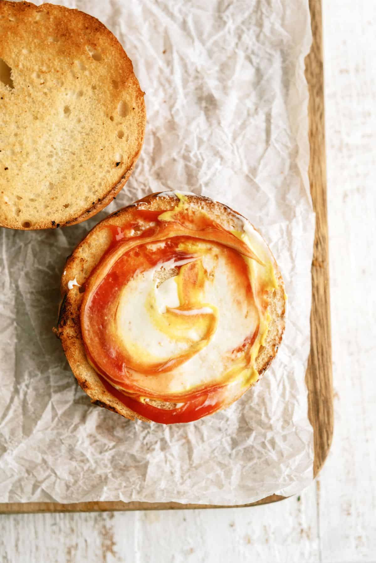 Toasted bun with toppings for the Classic Burger