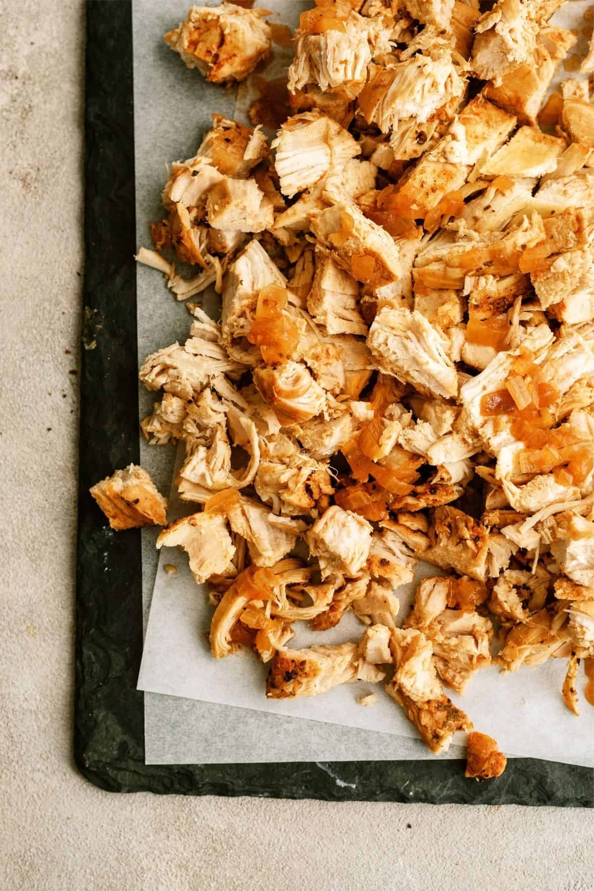 Copycat Chipotle Chicken shredded on a sheet pan