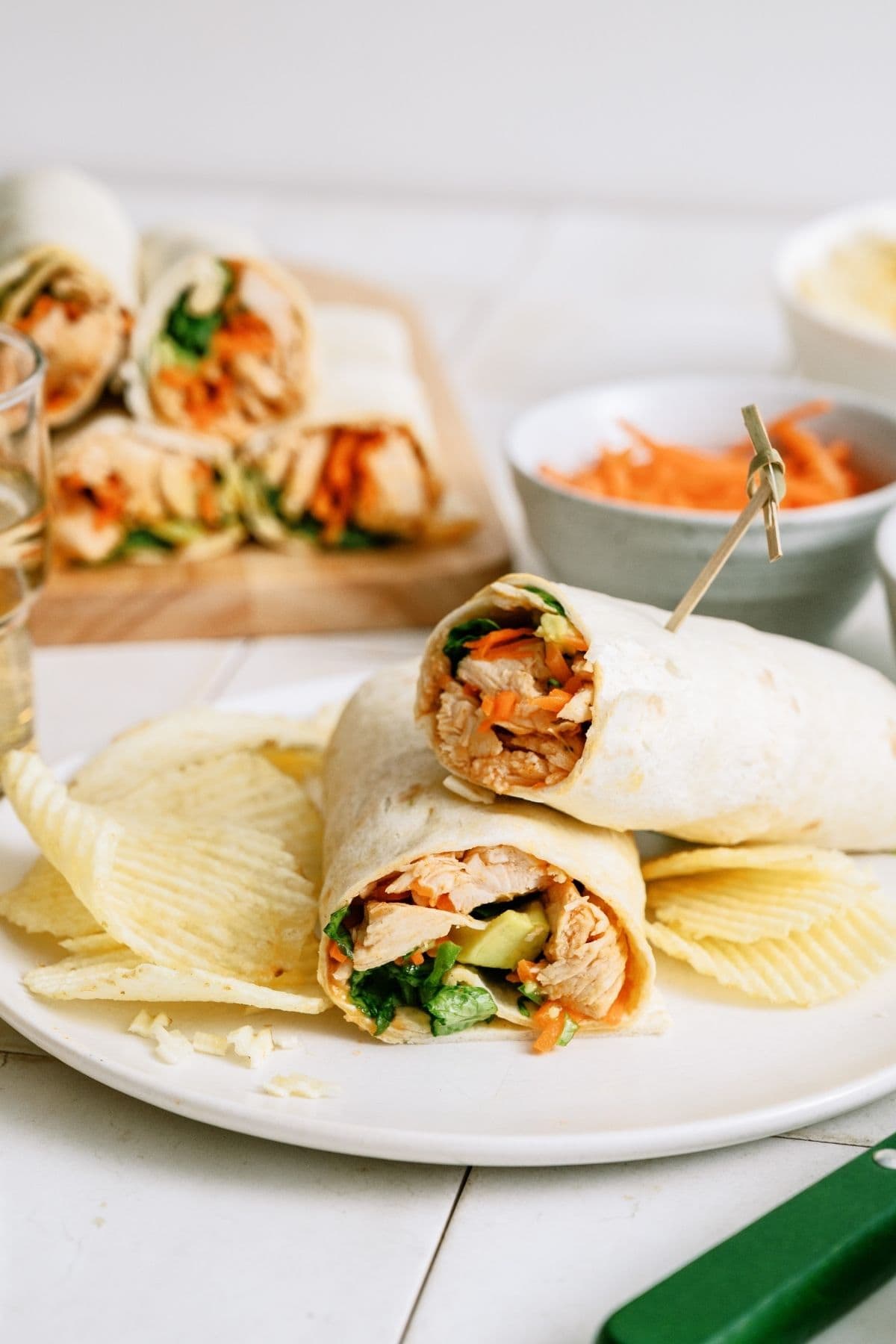 Instant Pot Buffalo Chicken Wrap on a plate with potato chips.