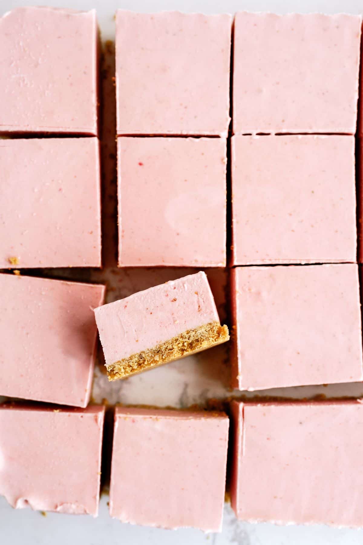 No Bake Strawberry Cheesecake Bars cut into squares