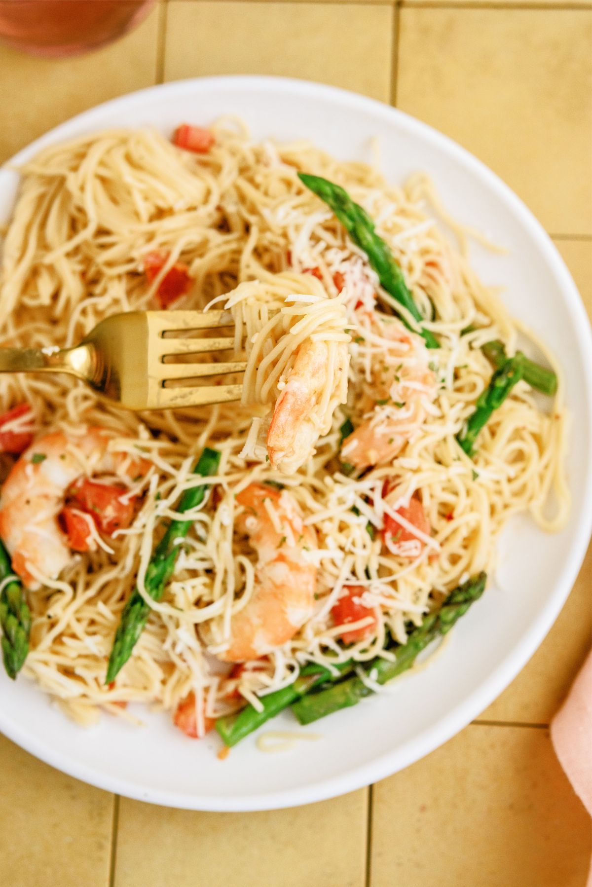 Close up of Olive Garden Shrimp Scampi Copycat recipe on a plate with a fork