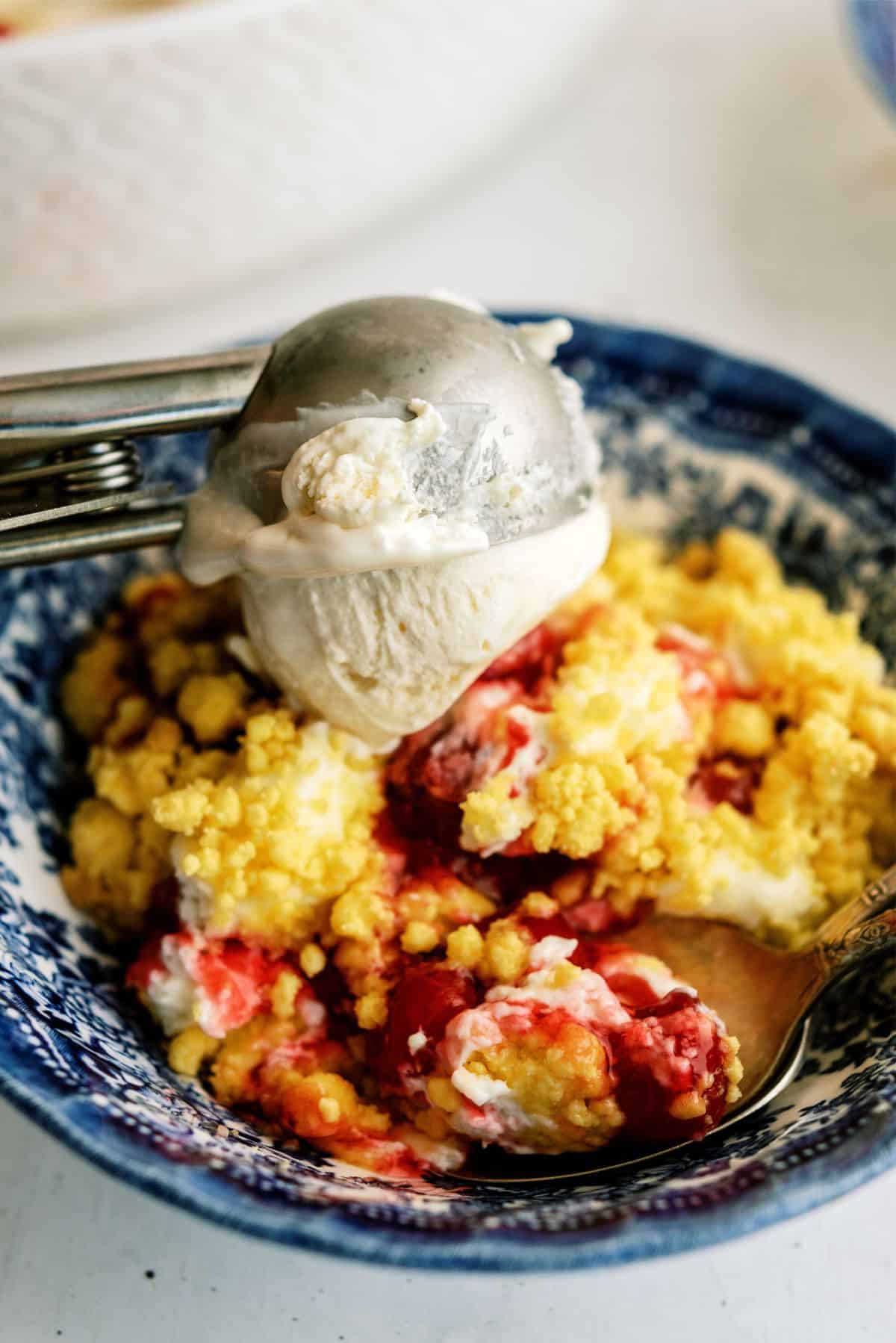 Slice of Cherry Cheesecake Dump Cake on a plate 